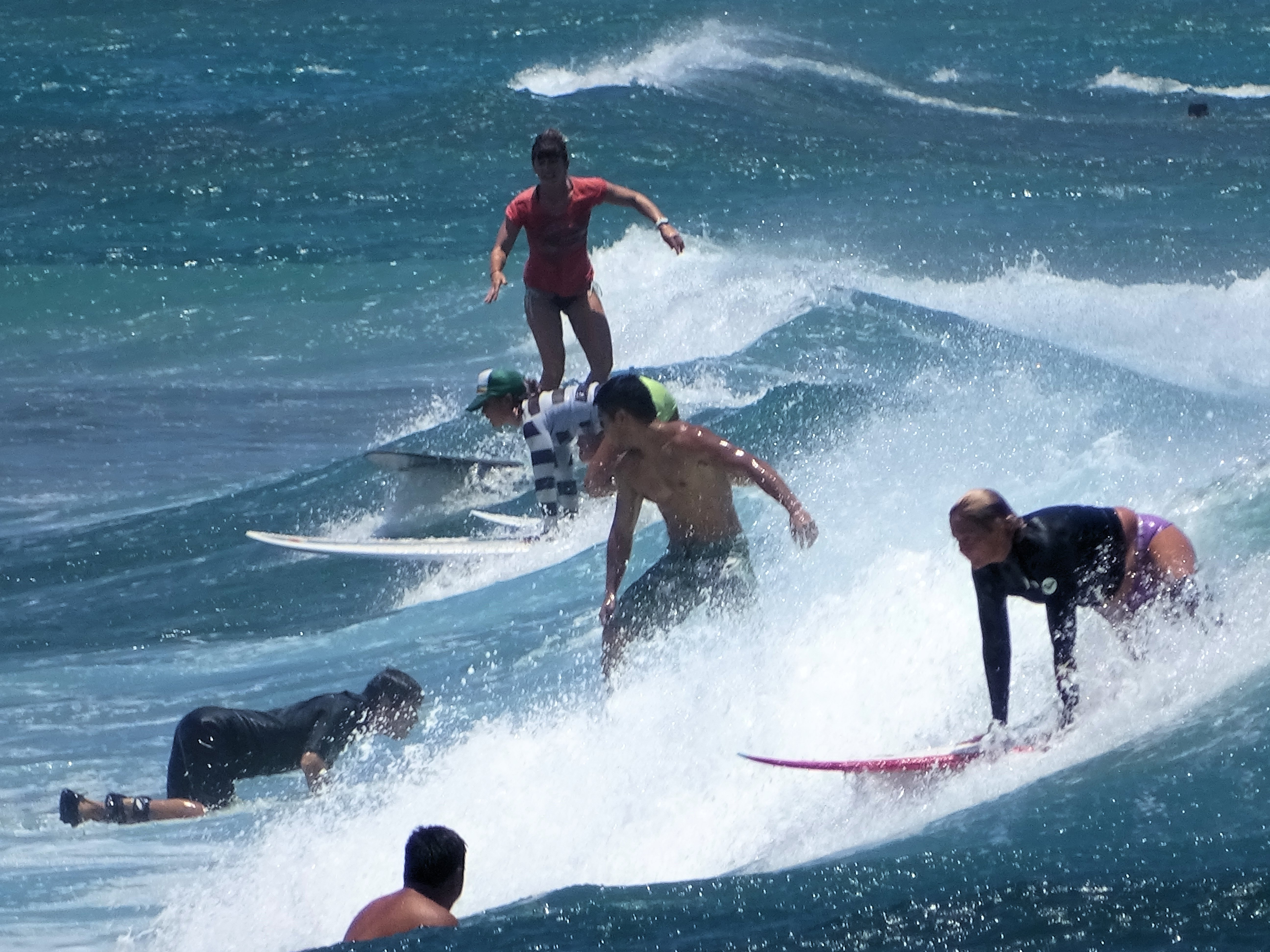 [Surfing at Waikīkī, 2014] Photo by James Brennan.