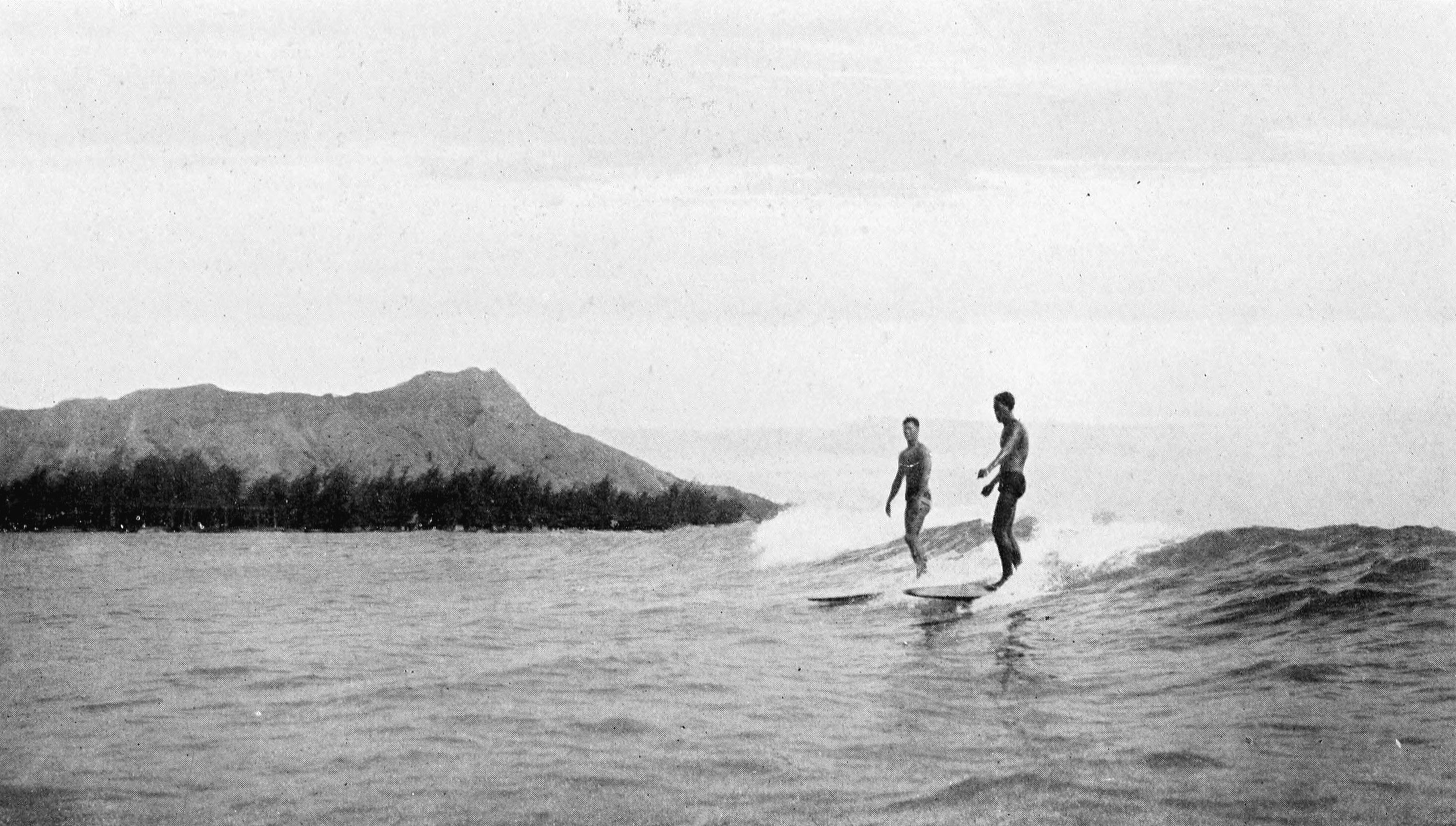 [Surfing at Waikīkī, 1921] At the left is Diamond Head. From Collier's New Encyclopedia.