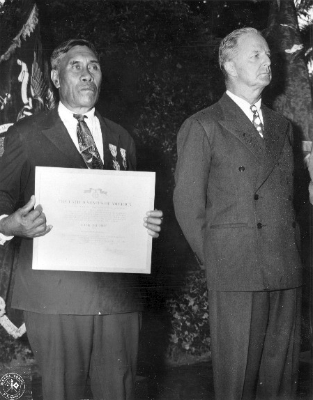 [Benehakaka Kanahele] Receiving Presidential Medal for Merit and Purple Heart for his heroic deeds. Photo by US Army Signal Corps.