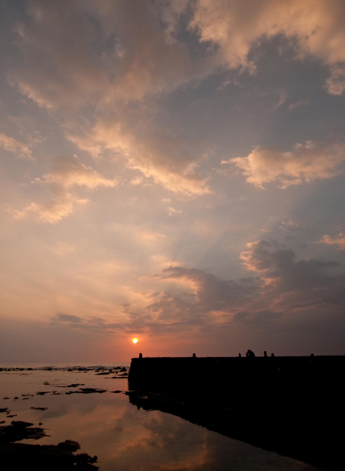 [Sun over heiau] Photo by Ruben Carillo.