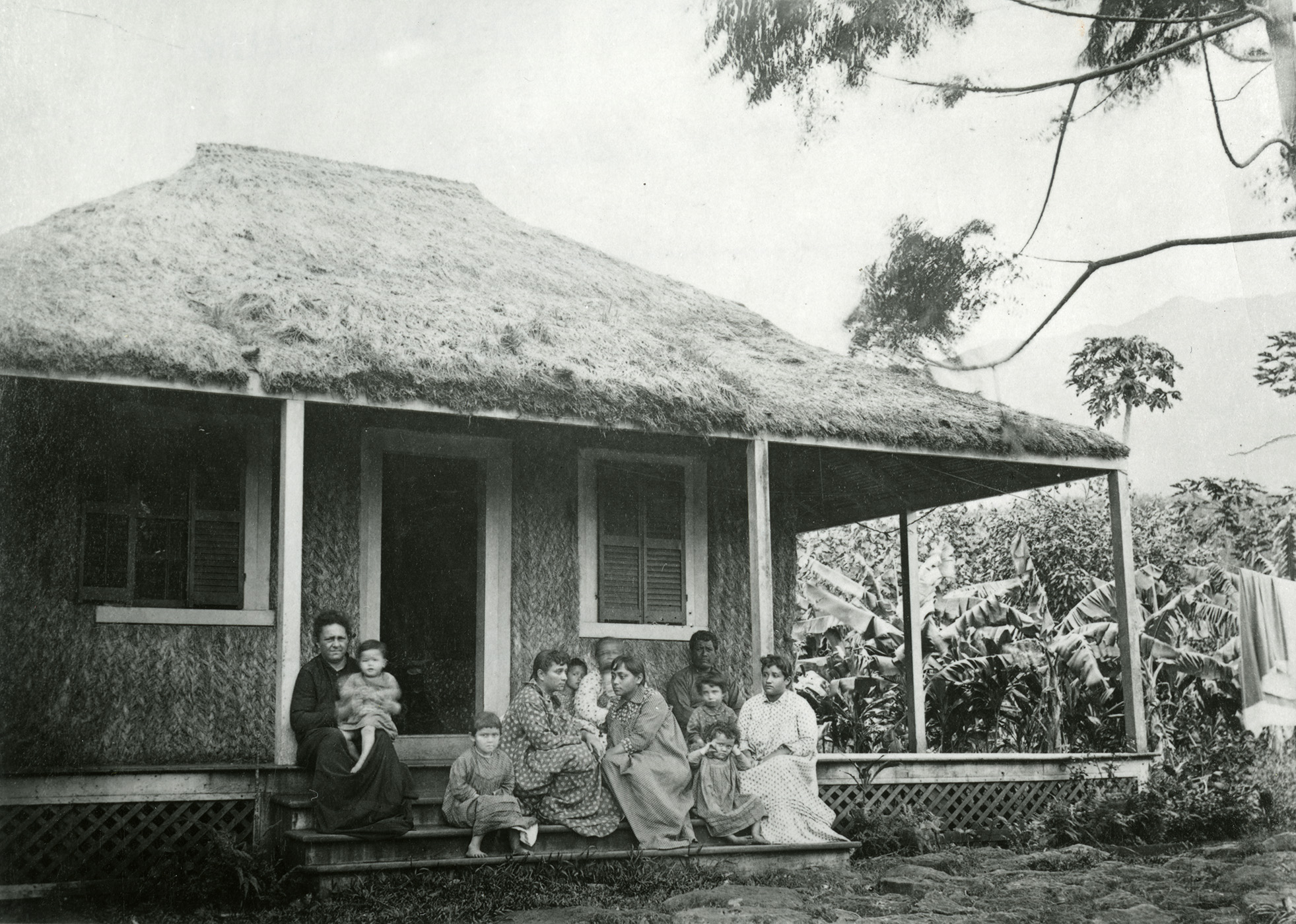 [Family in front of hale] Photographer unknown.